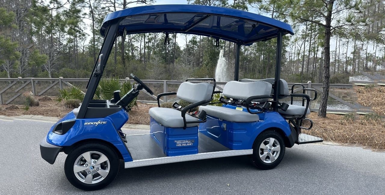 A white Electric Cart Company golf cart delivered and parked outside a 30A vacation rental